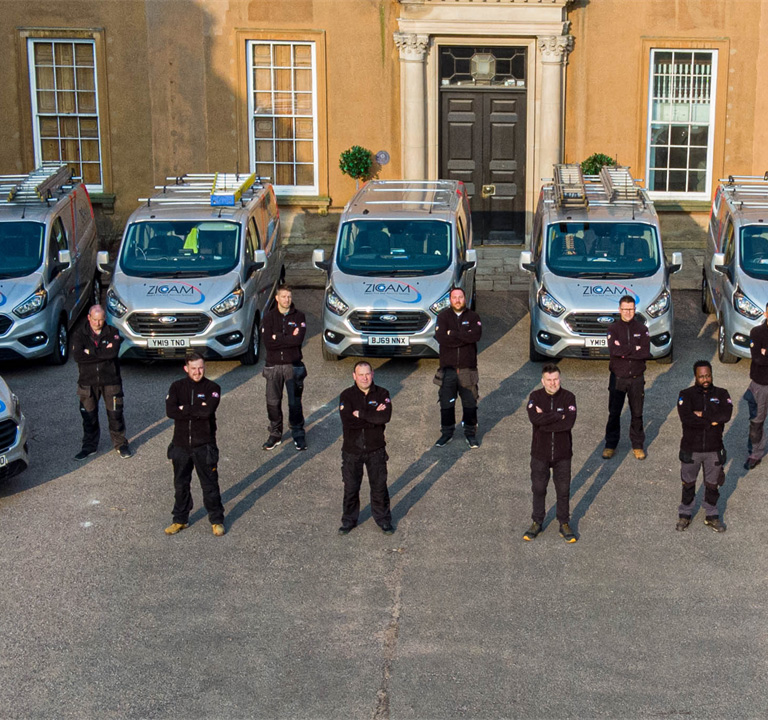 The Zicam team in front of vans