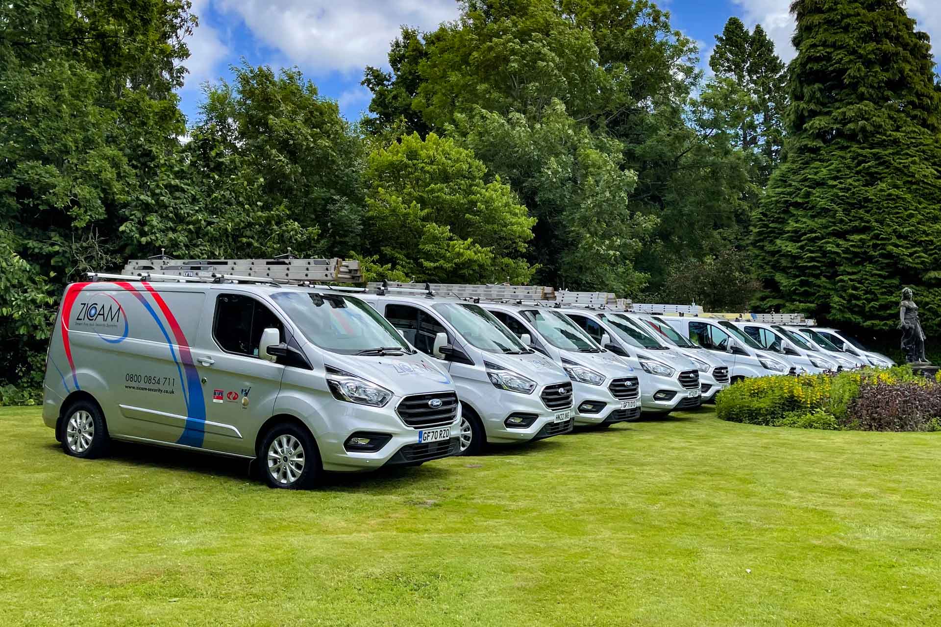 An image of Zicam vans on a field